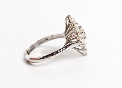 Lot 18 - A white gold and diamond ring set with nine...