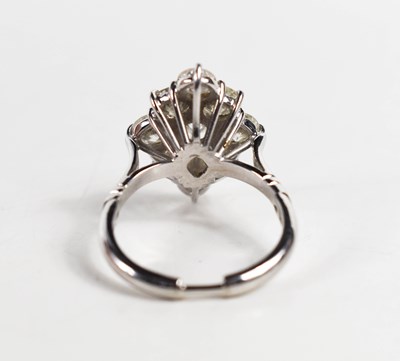 Lot 18 - A white gold and diamond ring set with nine...