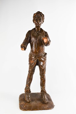Lot 323 - A treen carved German figure of a boy, painted...
