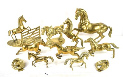 Lot 448 - A collection of brass horse ornaments together...