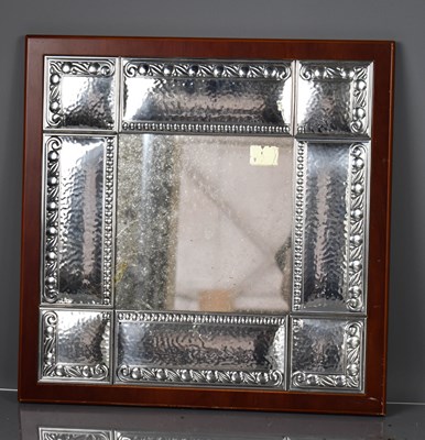 Lot 305 - A white metal Italian mirror, with hammered...