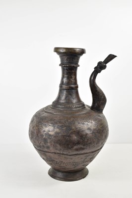 Lot 446 - A Persian bronzed metal water vessel, with...