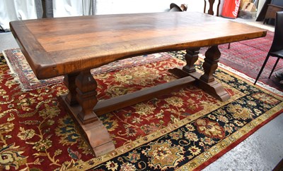 Lot 549 - A solid oak 17th century style trestle table,...