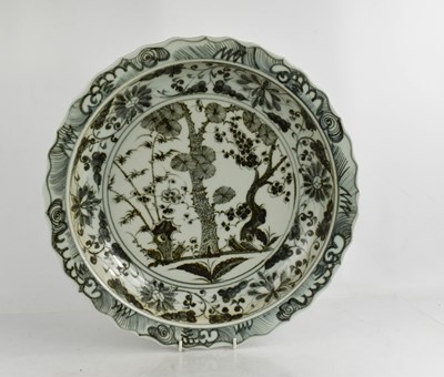 Lot 419 - A large Chinese shallow dish, with shaped edge,...