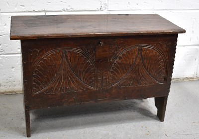 Lot 555 - A small 17th century oak coffer, the planked...