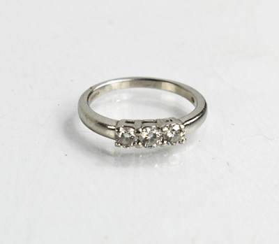 Lot 20 - A platinum and diamond three stone ring, the...