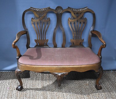 Lot 558 - A Queen Anne style settee, with walnut double...