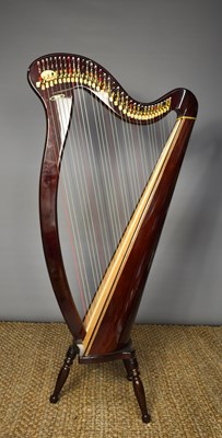 Lot 508 - A modern Aoyama harp, raised on three turned...