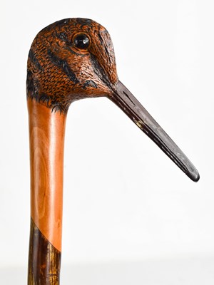 Lot 301 - A treen walking cane, carved in the form of a...