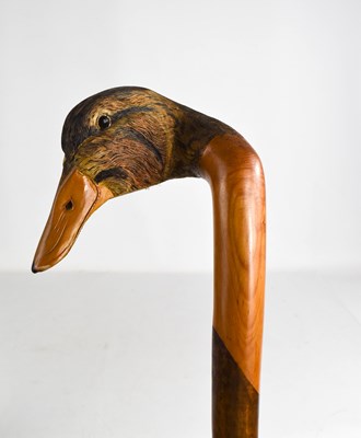 Lot 302 - A treen walking cane, the handle carved in the...