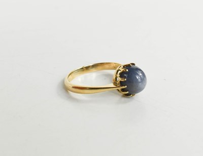 Lot 45 - A 9ct gold and star sapphire set ring, oval...
