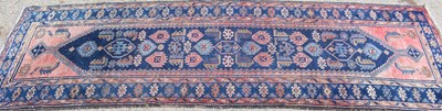 Lot 484 - An antique Middle Eastern blue and pink ground...