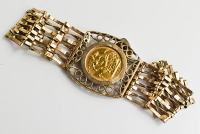 Lot 309 - A 9ct gold bracelet set with a full sovereign...