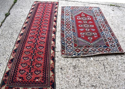 Lot 501 - A Middle Eastern wool runner 287cm by 79cm...
