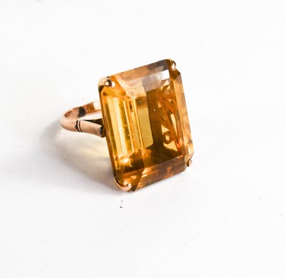 Lot 317 - A 14ct gold and yellow quartz ring, the trap...