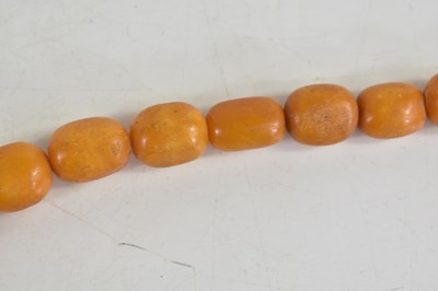 Lot 18 - A vintage butterscotch amber beaded necklace,...