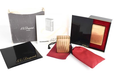 Lot 187 - Two Dupont vintage lighters, one engraved with...