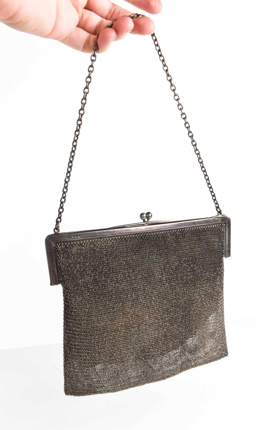 Lot 49 - A silver chainmail evening bag, with leather...