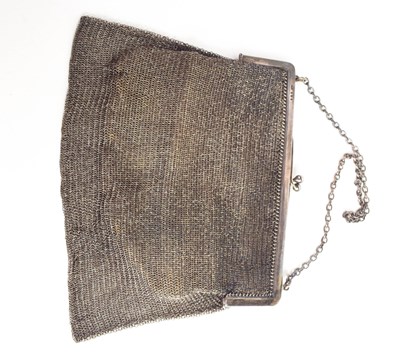 Lot 49 - A silver chainmail evening bag, with leather...