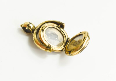 Lot 180 - A gold plated, agate and sardonyx locket, of...