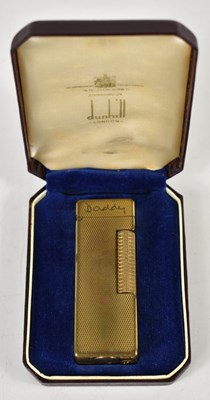 Lot 185 - A vintage gold tone Dunhill lighter, the top...