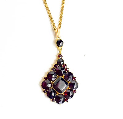 Lot 183 - A 9ct gold and garnet pendant necklace, with a...