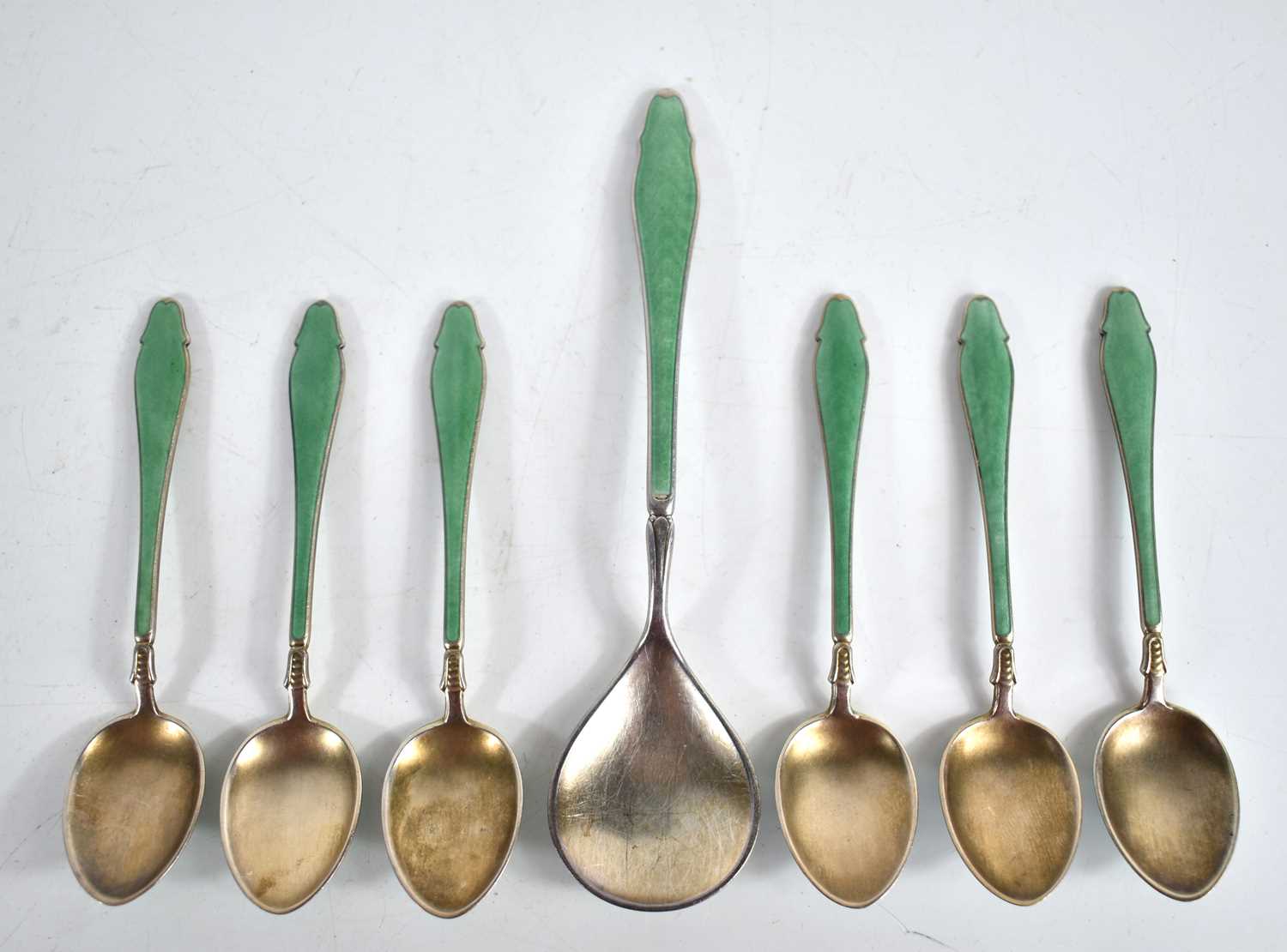 Lot 9 - A set of six silver and guilloche enamel...