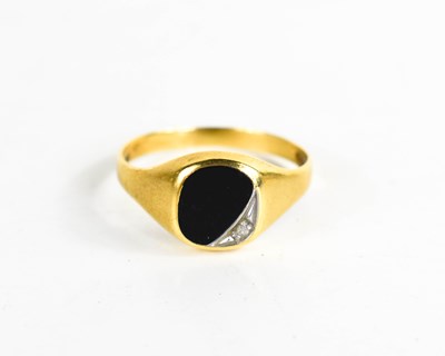 Lot 154 - An 18ct gold signet ring, set with black agate...