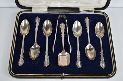 Lot 21 - A cased set of six silver tea spoons, sugar...