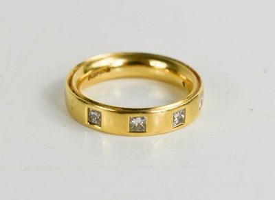 Lot 163 - An 18ct gold and diamond ring, the band inset...