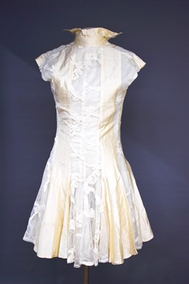 Lot 197 - An Andrew Majtenyi vintage cream silk dress,...