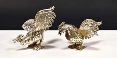 Lot 234 - A pair of silver plated table cockerels, in...