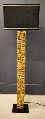 Lot 586 - A modern gold coloured standard lamp with a...