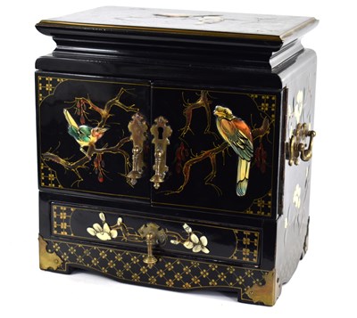 Lot 255 - A Chinese black lacquered two door cabinet...