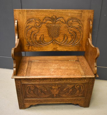 Lot 523 - An oak monks bench, the underside lid / back...