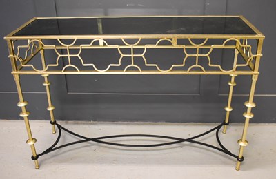 Lot 588 - A metal and glass top console table painted...