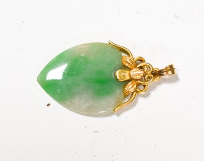 Lot 149 - An 18ct gold and jade pendant, the heart form...