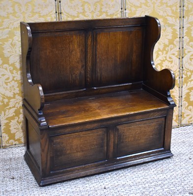 Lot 474 - A 20th century oak box settle in the old...