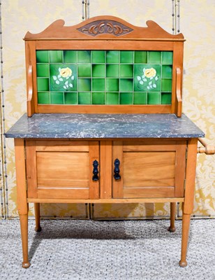 Lot 465 - An early 20th century pine washstand with...