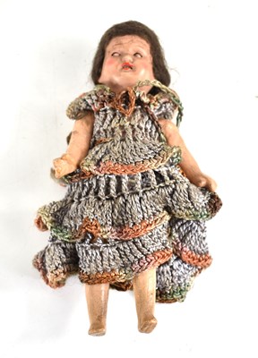 Lot 237 - An antique doll with composition legs and arms,...
