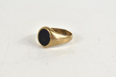 Lot 148 - A 9ct gold signet ring set with a black onyx...