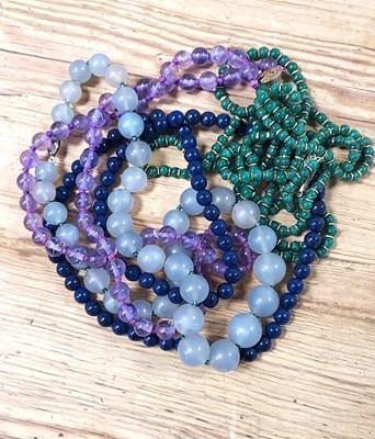 Lot 98 - A group of four vintage beaded necklaces,...