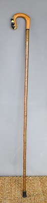 Lot 256 - A vintage shepherds crook, the handle carved...