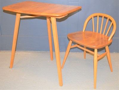 Lot 591 - An Ercol elm table extender together with an...
