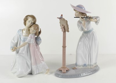 Lot 229 - A Lladro porcelain figurine; girl playing...