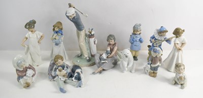 Lot 231 - A group of four Lladro figurines including...