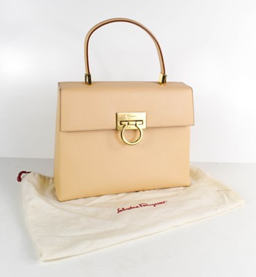 Lot 193 - A Salvatore Ferragamo cream leather hand bag,...