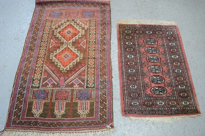 Lot 475 - A Middle Eastern wool prayer mat together with...