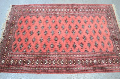 Lot 480 - A Tekke rug with a pink ground and Kufic style...