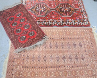 Lot 481 - A Tekke beige ground wool rug together with...